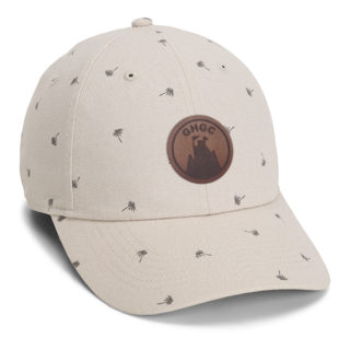 tan colored cotton canvas cap with all over palm tree print and goat hill golf course leather patch